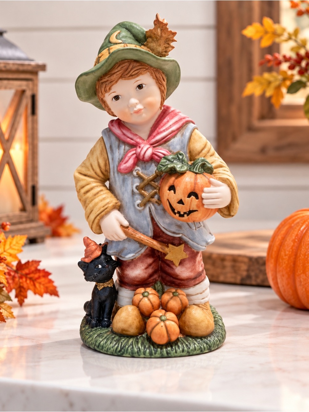 Beautiful Bisque Fall Figurine of a boy holding a pumpkin. Perfect for Halloween